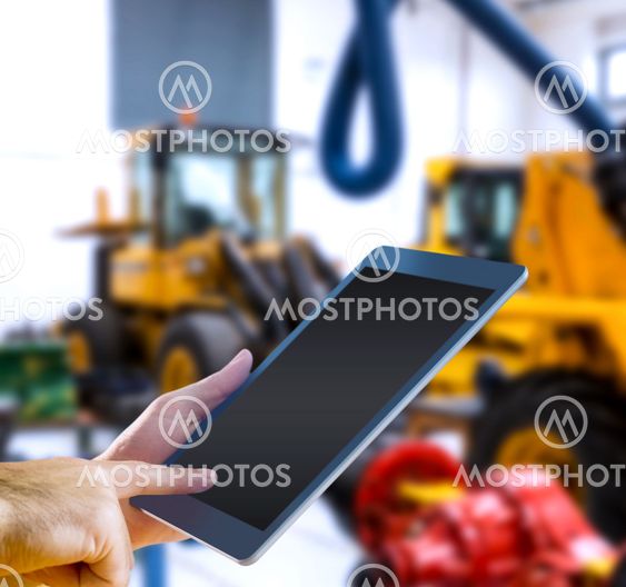 Composite image of man using tablet pc