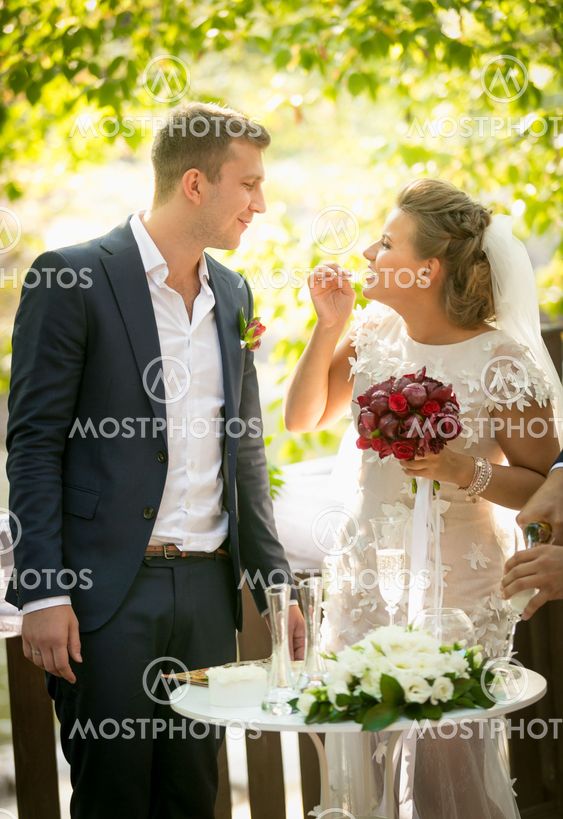laughing bride and groom looking at each other at wedding...