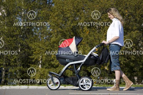 woman with pushing a pram