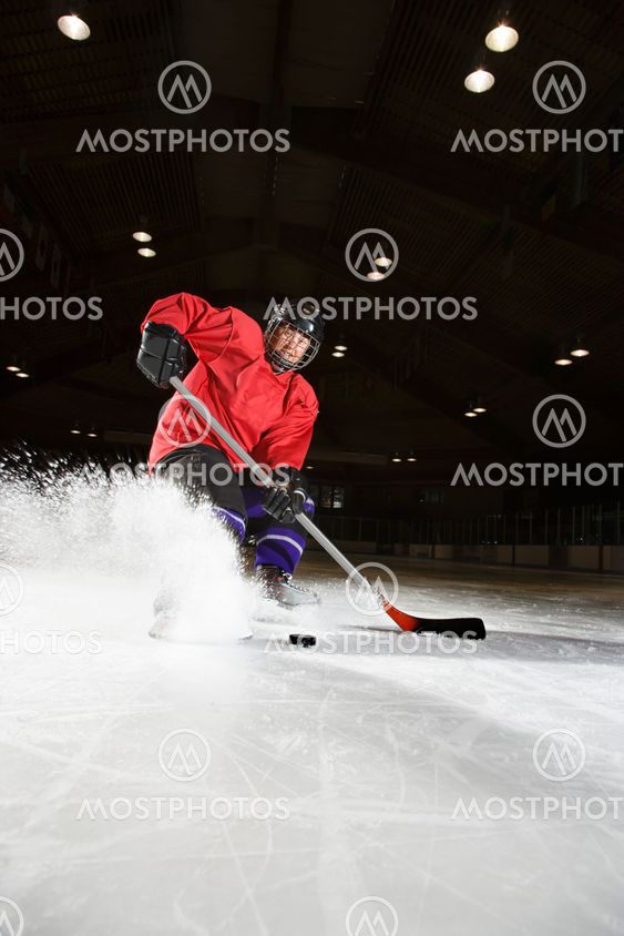 Woman playing hockey.