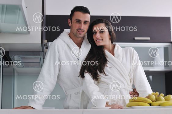young couple have fun in modern kitchen