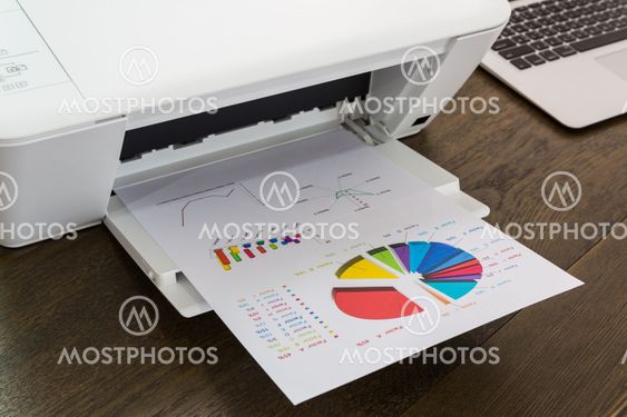 printer and Laptop on wood table