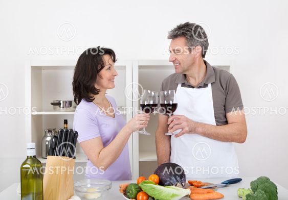 Senior couple cooking at home