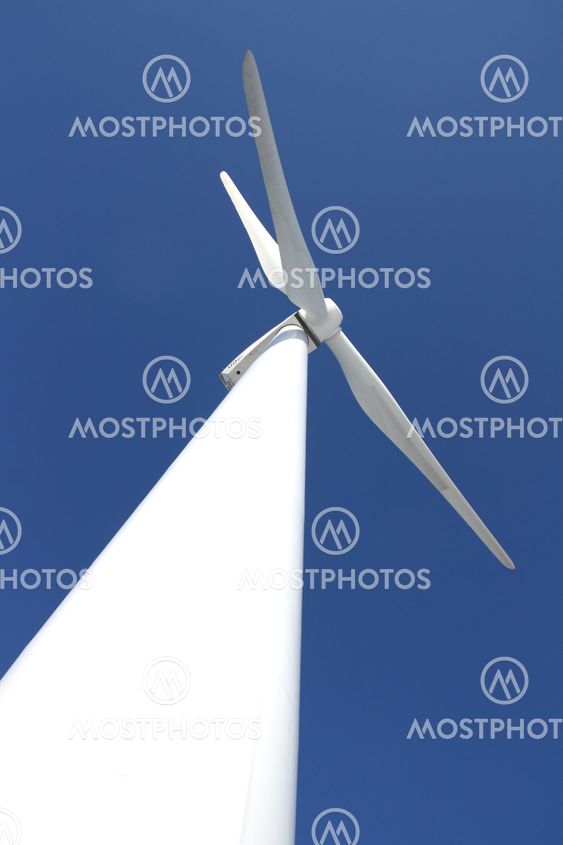 Windmill against blue sky
