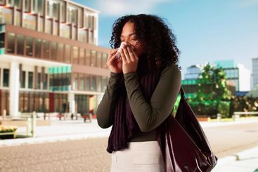 Woman With Allergy Outside In Spring