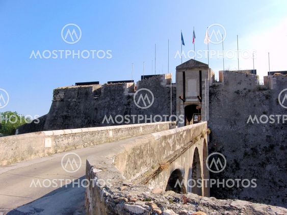 Gate of Old Fortress with flags
