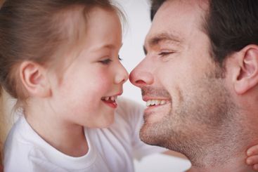 Daughter, daddy and nose touch in home, fun and love for...