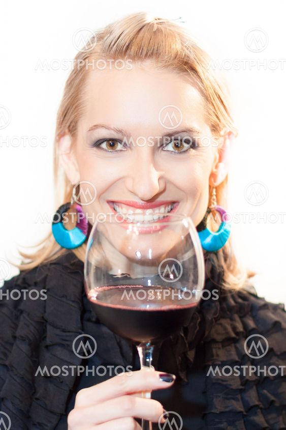 Toasting with a glass of red wine.