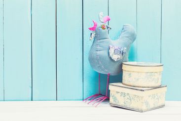 Cozy pastel wooden home decor objects on blue background