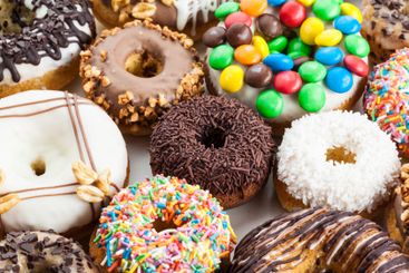 Close up of a selection of colorful donuts.
