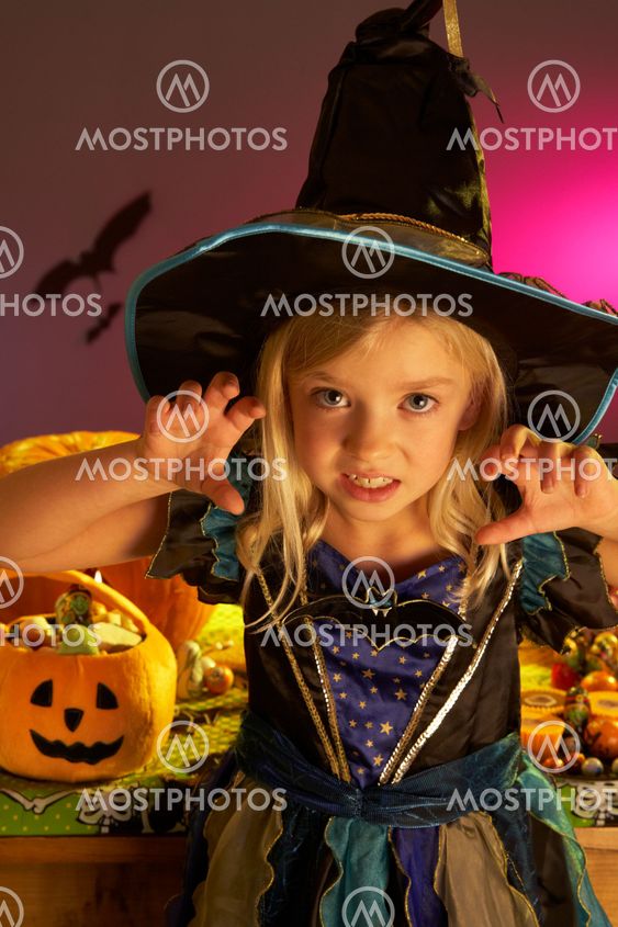 Halloween party with a child wearing scaring costume