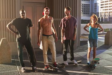 Group, people and skateboard with fitness in city for...