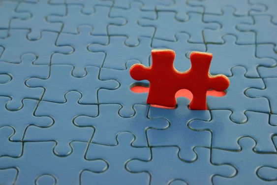 Blue Jigsaw with red piece