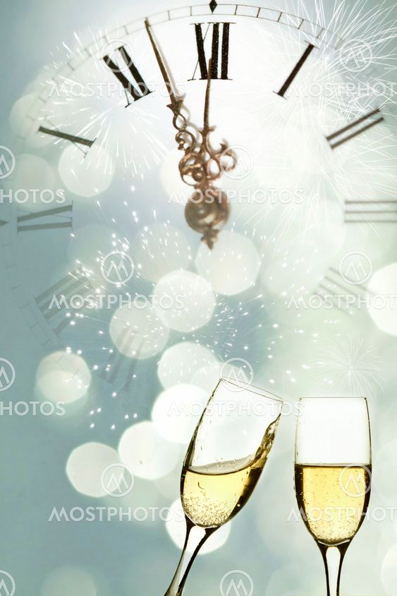 Glasses of champagne against holiday lights