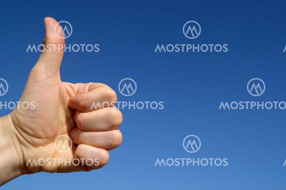 Thumbs up with blue sky background and space for text.
