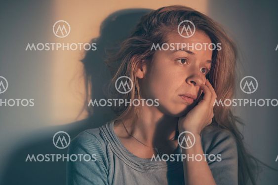 A woman sitting alone and depressed
