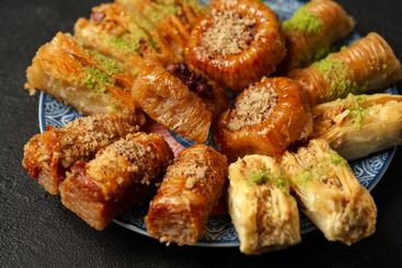 Diverse assortment of traditional pastries arranged on a...