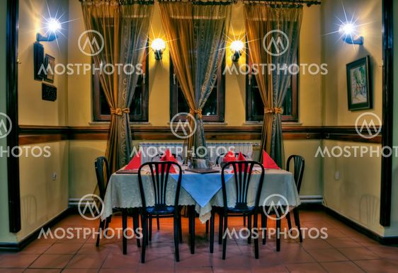 Restaurant dinner on table with chairs and lamp