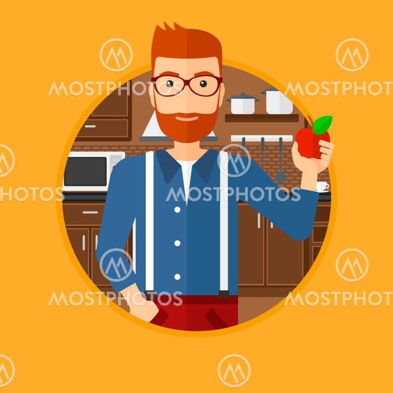 Young man with apple in the kitchen.