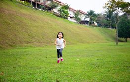 Asian Little Chinese Girl running happily