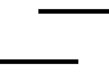 Graduate with Cap and Gown Standing Next to Tassel...