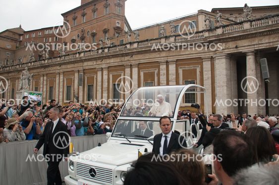 Pope Benedict XVI blesses people at Saint Peter's square in Vatican.
