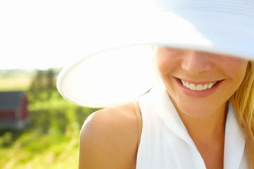 Hat, happy woman and hide face on vacation, holiday or...