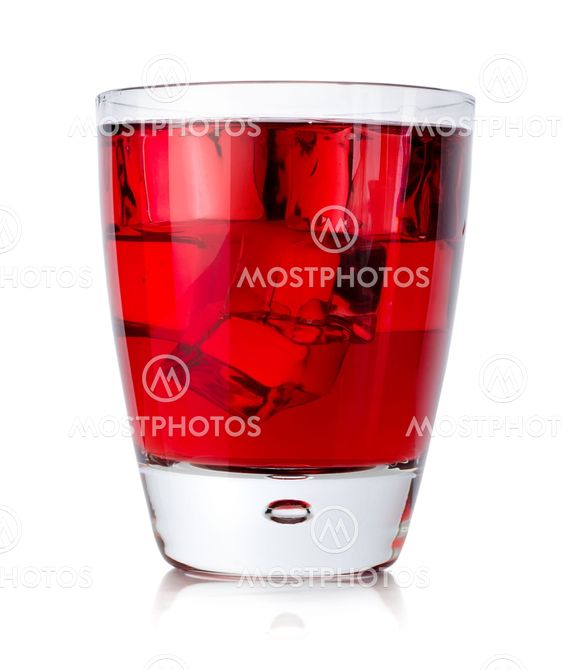 Red drink with ice cubes in a glass