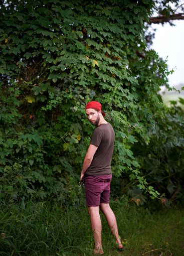 Travel, man and peeing outdoor in nature, hiking or...