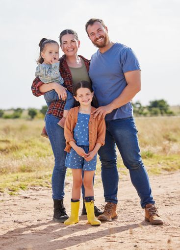 Portrait, parents and children with smile in farm,...