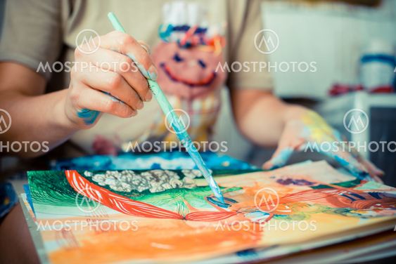 particular of woman painter hand painting