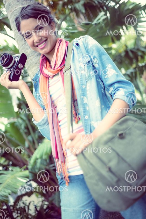 Happy photographer standing outside smiling at camera