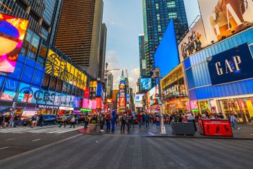 Colorful evening lights and crowds of people at Times...