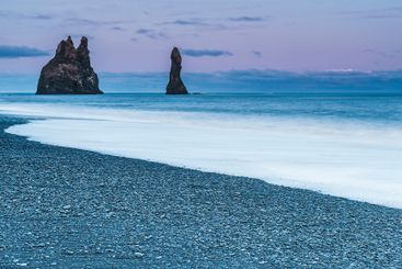 Coastal scenery at dusk showcasing Iceland's unique rock...