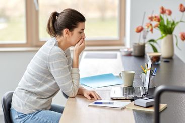 woman with laptop working at home office