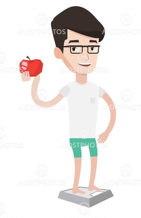 Man standing on scale and holding apple in hand.