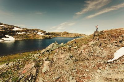Tourist taking photo in norwegian nature