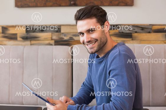 Young man using his tablet pc