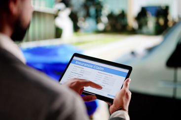 Black Insurance Expert Evaluating Vehicle Damage After...