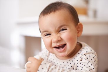 Baby, toddler portrait and laugh in home, childhood and...