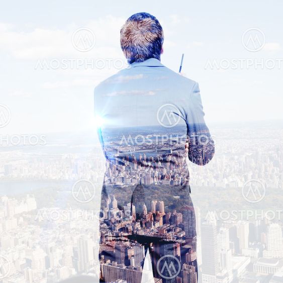Composite image of thoughtful businessman holding pen