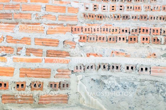 the underconstruction staircase made by red brick and...