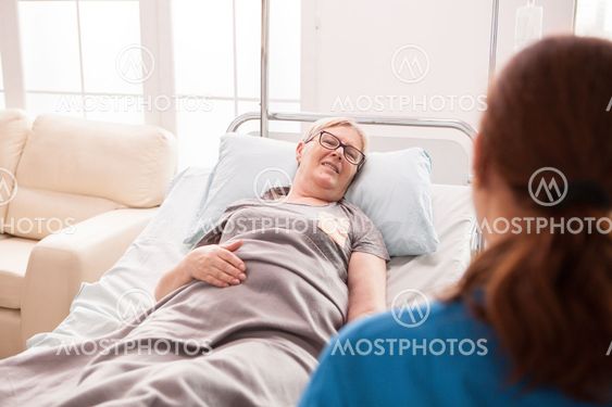 Back view of female doctor in nursing home