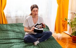 Female experiencing futuristic technology while sitting...