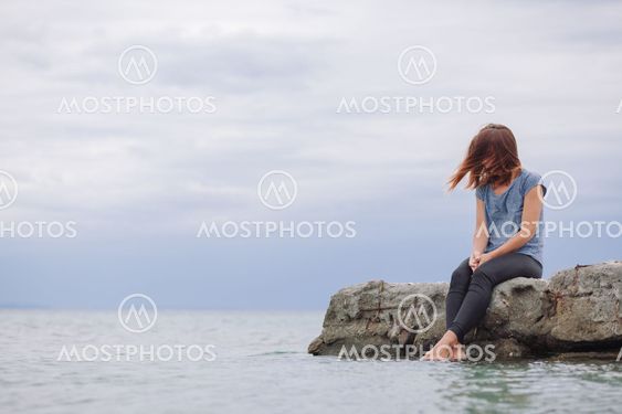 Woman alone and depressed screaming on the bridge