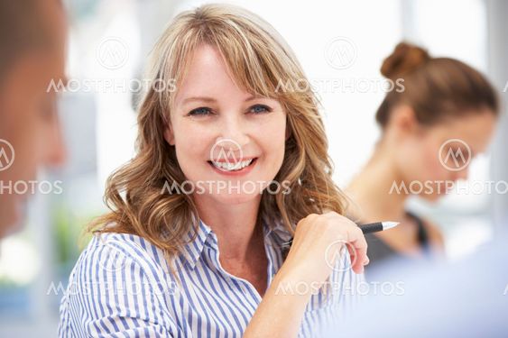 Mid age businesswoman in meeting