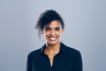 Happy, professional and portrait of woman in studio for...