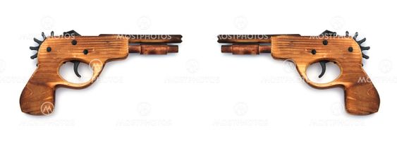 Toy wooden gun , on a white background