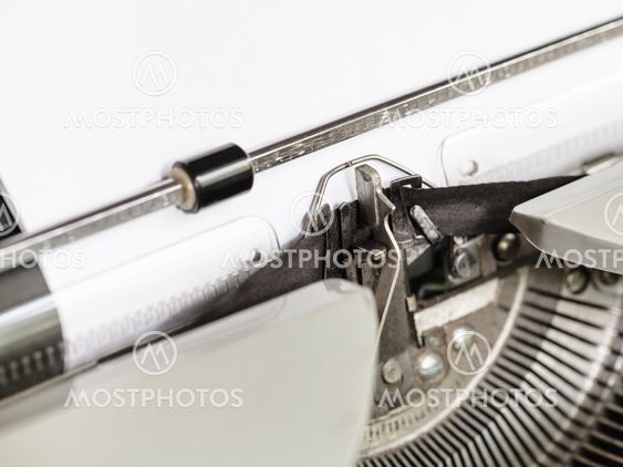 side view of typebar types ribbon in typewriter