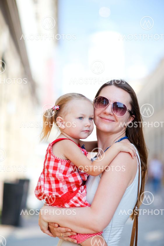 Mother and daughter portrait outdoors
